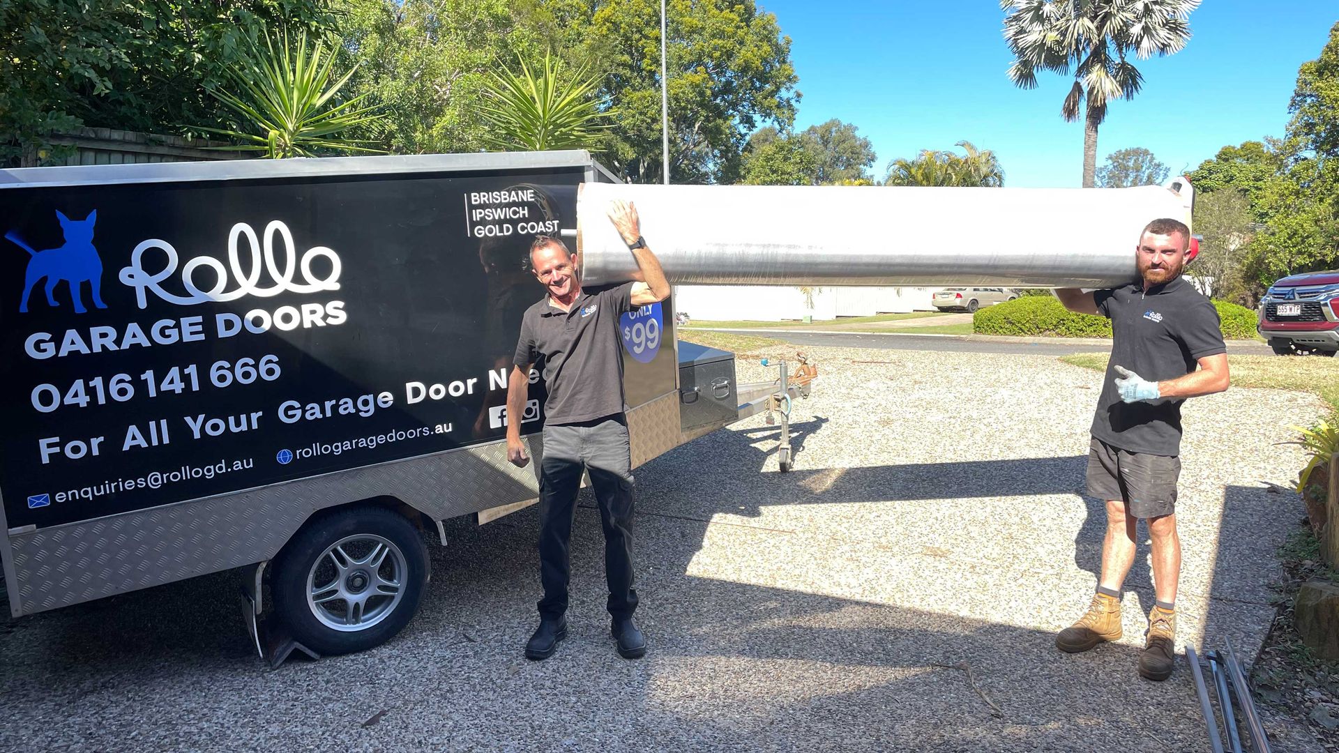 Julian and Jacob holding garage door